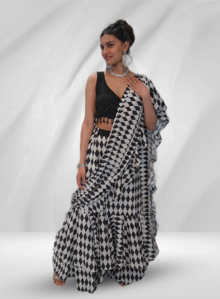 Black Embroidered Blouse With Layered Black And White Saree - Rent